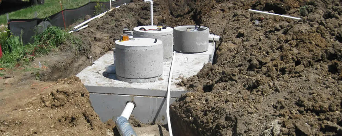 Septic system repair and installation site with tank access ports in Beverly, MA